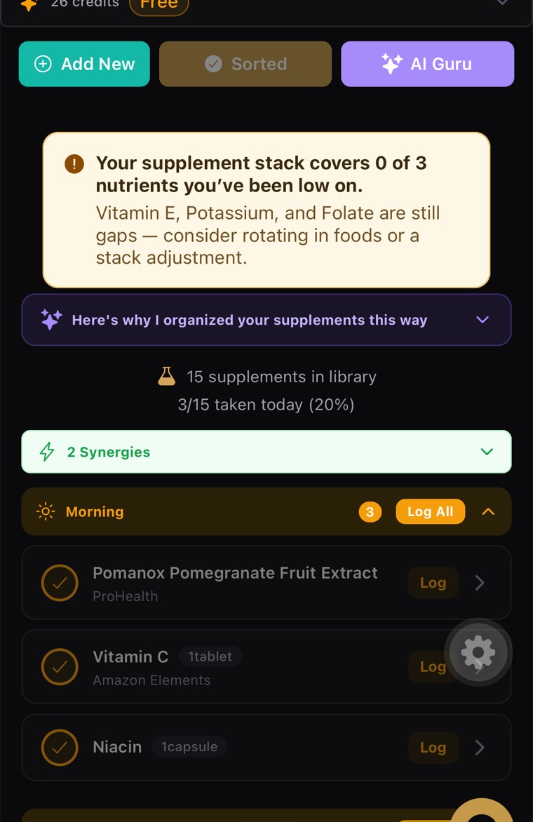 My Supplements screen in the app: a banner noting the stack covers 0 of 3 nutrients that have been low, an explanation of how the AI organised the stack, 15 supplements in the library, 2 synergies found, and a Morning group listing pomegranate extract, vitamin C and niacin with Log buttons.